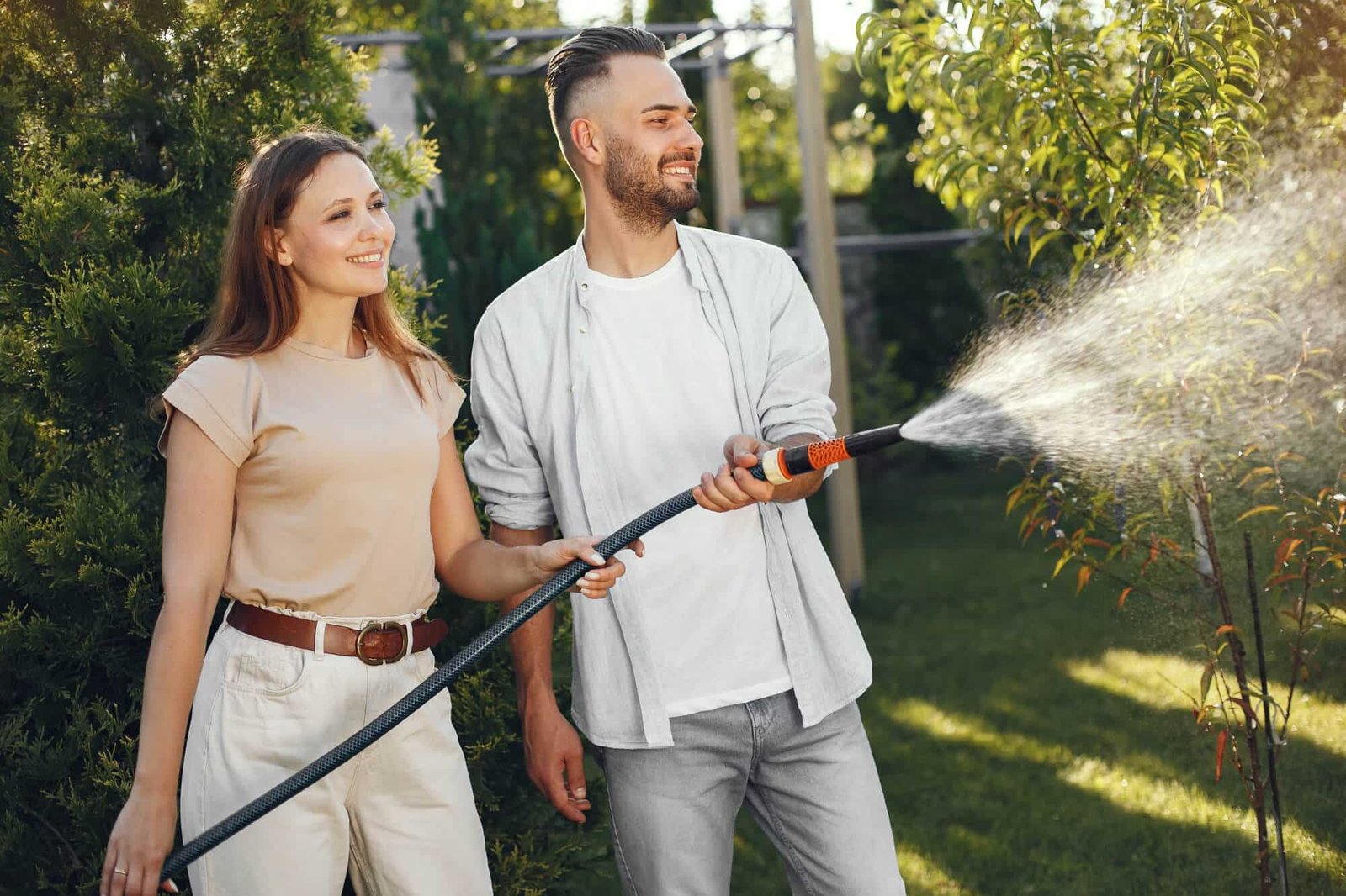 Summer garden maintenance focused on watering harvesting and pest checks